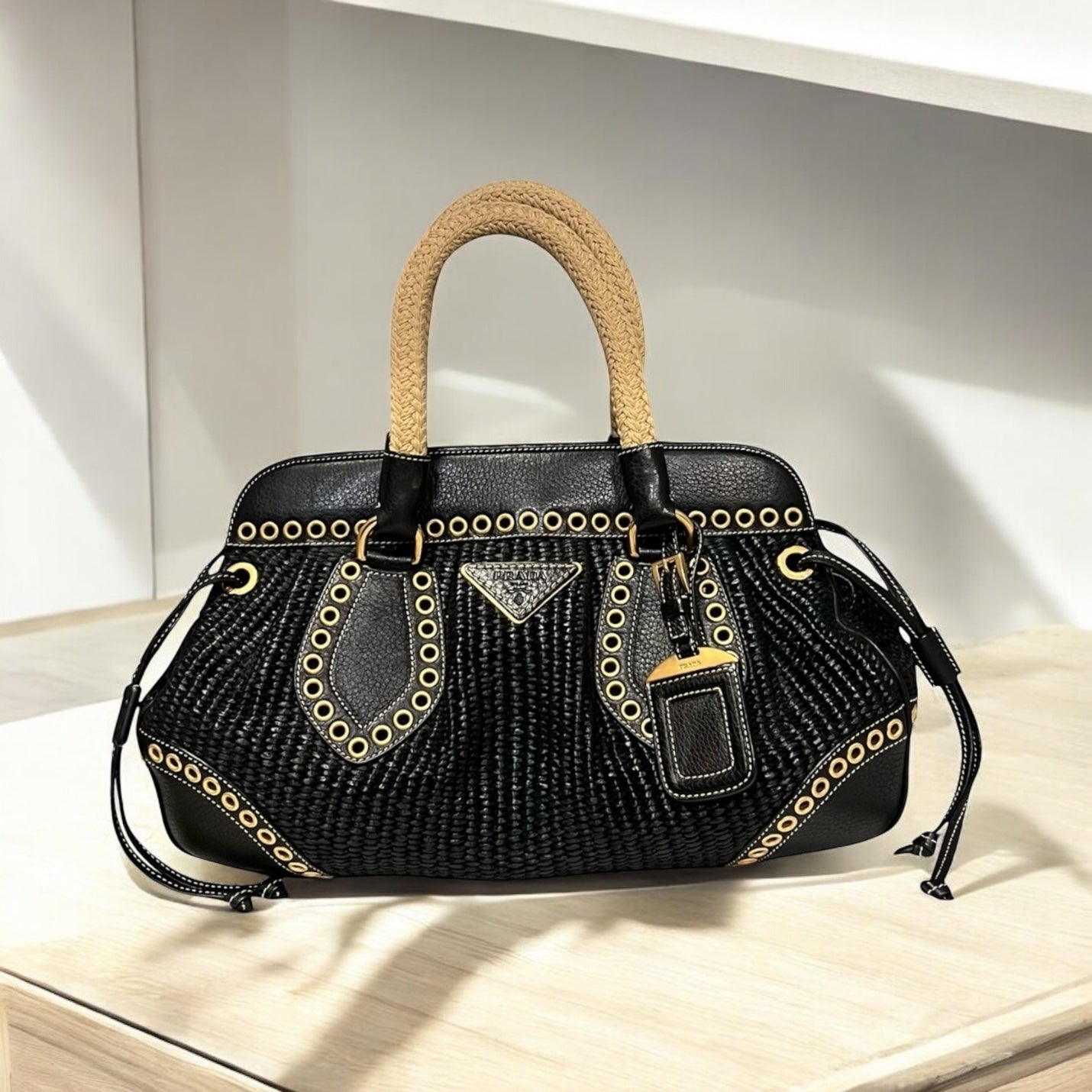 PRADA Grommet Raffia Handbag in Black