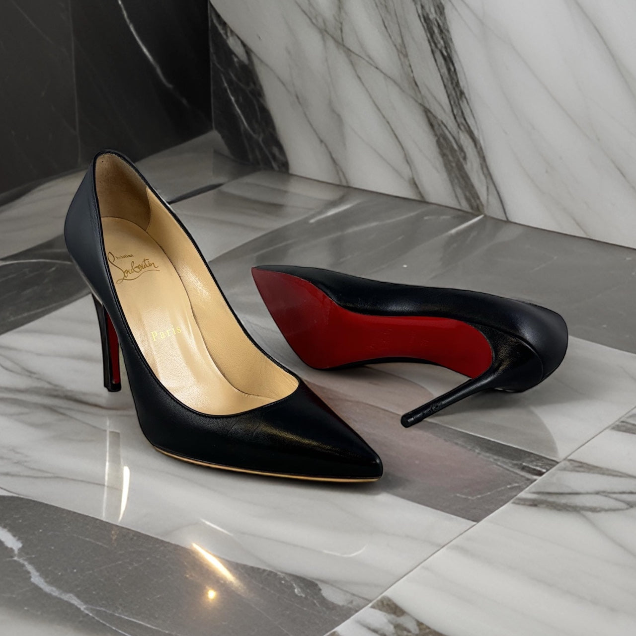 CHRISTIAN LOUBOUTIN Decollette Pumps in Black | Size 37