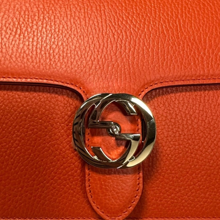 GUCCI Interlocking G Crossbody Shoulder Bag in Fire Coral Grained Leather