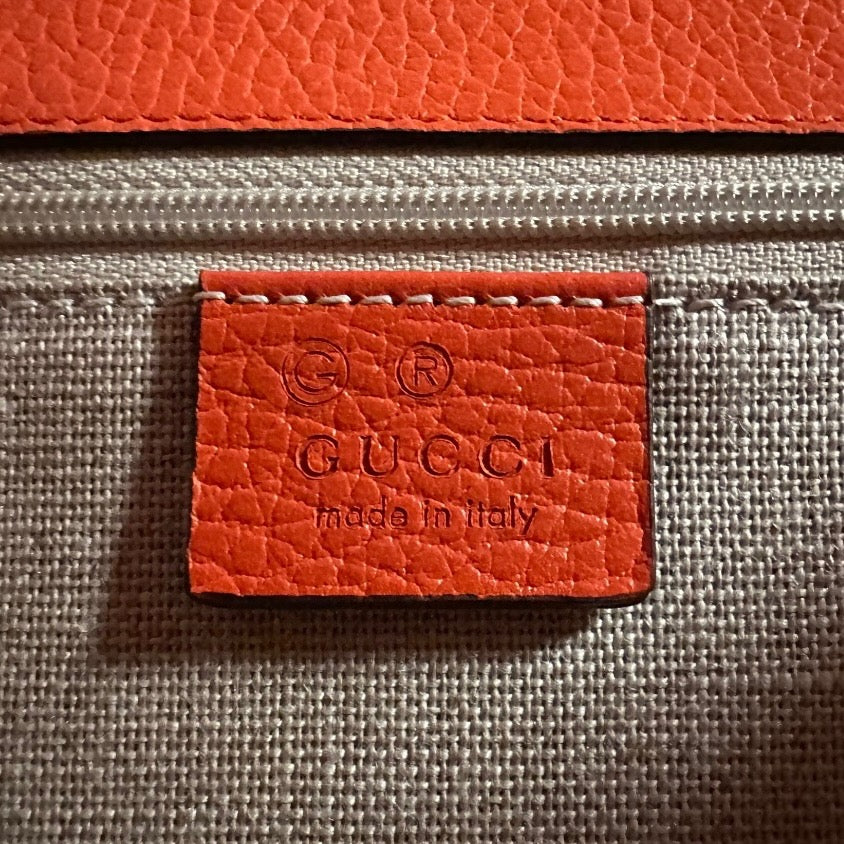 GUCCI Interlocking G Crossbody Shoulder Bag in Fire Coral Grained Leather