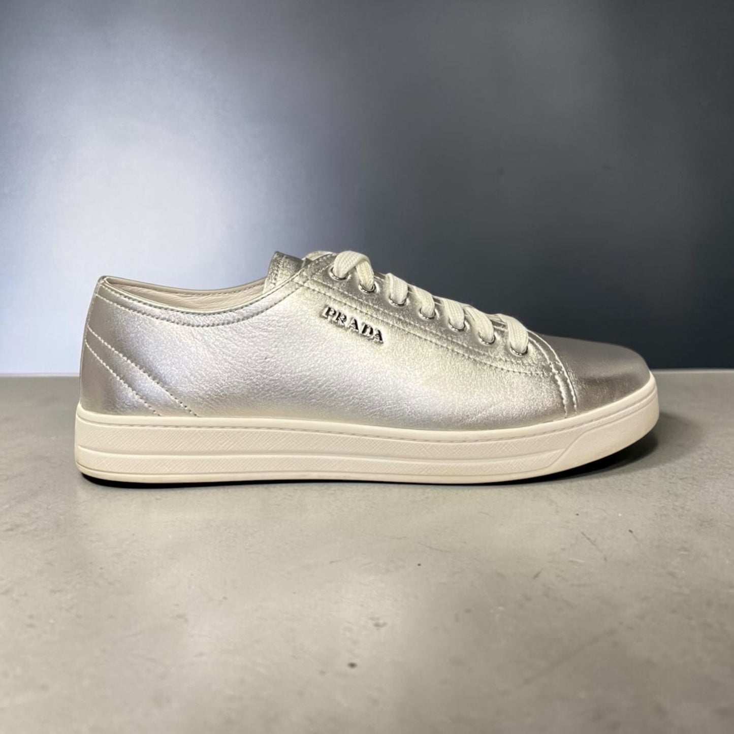 PRADA Metallic Leather Sneakers in Silver |